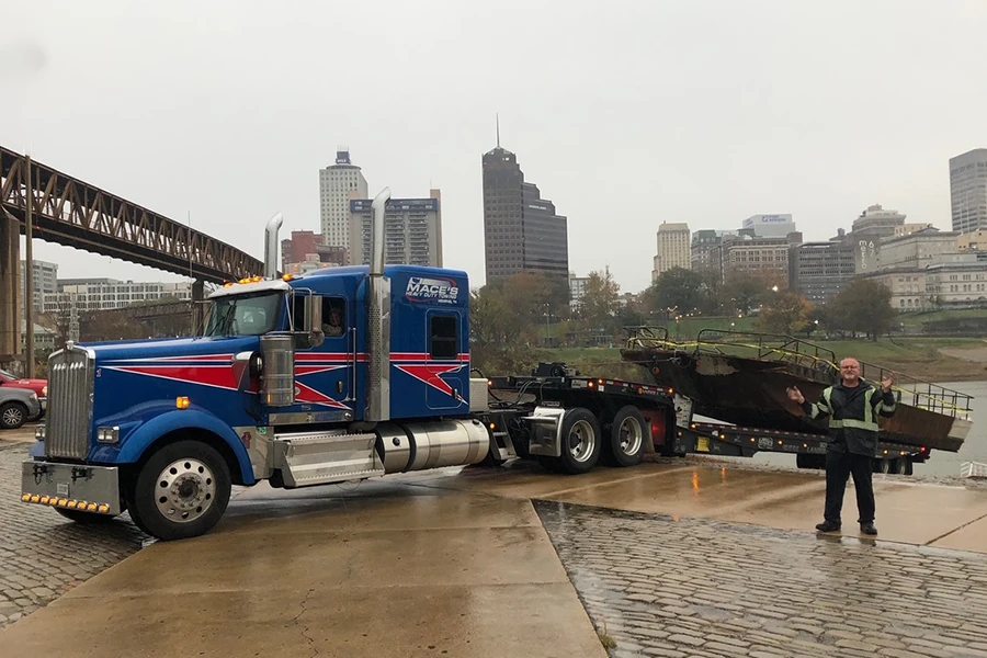 Mace's hauling a pontoon boat out of a river