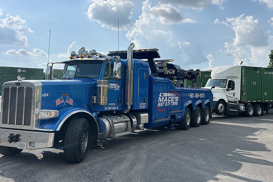 Heavy Duty Tow Truck pulling a tractor trailer